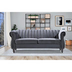 Canapé Chesterfield en velours avec accoudoirs roulés classiques et dossier capitonné pour salon élégant